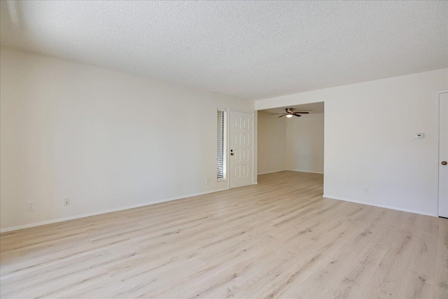 232 Rosewood St, Ventura, CA 93001 - unfurnished room with light wood-type flooring, a textured ceiling, and baseboards
