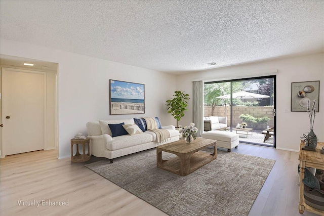 232 Rosewood St, Ventura, CA 93001 - living area featuring wood finished floors, a textured ceiling, and baseboards