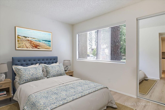 232 Rosewood St, Ventura, CA 93001 - bedroom featuring wood finished floors, a textured ceiling, and baseboards