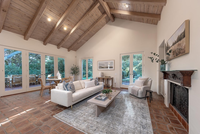 603 Juan Crespi Ln, Montecito, CA 93108 - living room featuring french doors, high vaulted ceiling, wooden ceiling with exposed beams, a fireplace, and plenty of natural light