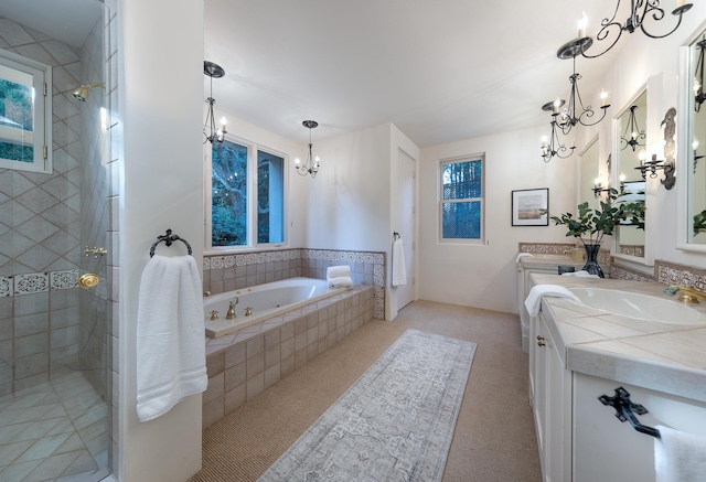 603 Juan Crespi Ln, Montecito, CA 93108 - full bathroom featuring a chandelier, a tub with jets, vanity, and tiled shower