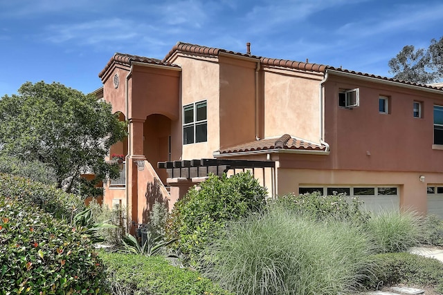 4735 Greenway Rd, Santa Barbara, CA 93110 - view of front of house featuring a tiled roof, stucco siding, and a garage