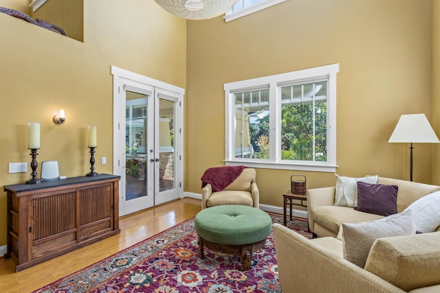 5049 Via Lara Ln, Santa Barbara, CA 93111 - sitting room featuring french doors, wood finished floors, baseboards, and a high ceiling