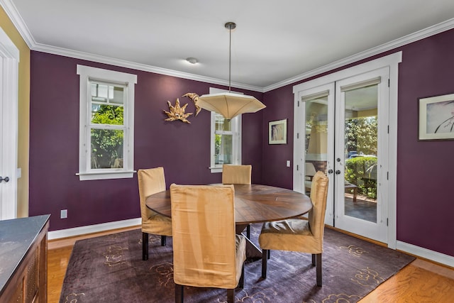 5049 Via Lara Ln, Santa Barbara, CA 93111 - dining room with french doors, wood finished floors, baseboards, and crown molding