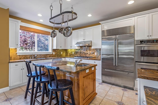 5049 Via Lara Ln, Santa Barbara, CA 93111 - kitchen featuring appliances with stainless steel finishes, a sink, light tile patterned floors, and recessed lighting