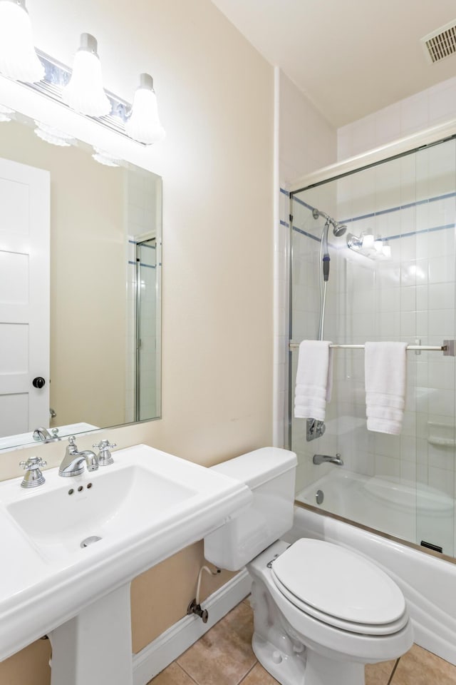 5049 Via Lara Ln, Santa Barbara, CA 93111 - full bath featuring tile patterned floors, toilet, combined bath / shower with glass door, and baseboards