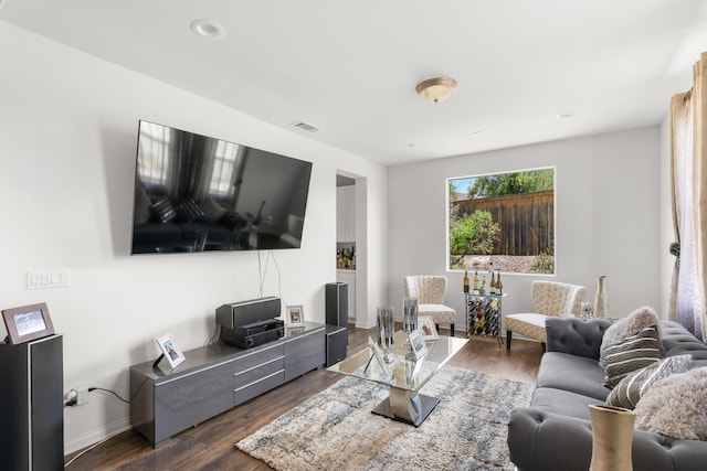 living room featuring dark wood-style floors and baseboards