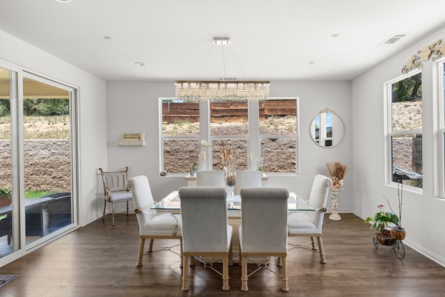 dining area featuring dark wood-style flooring, baseboards, and recessed lighting