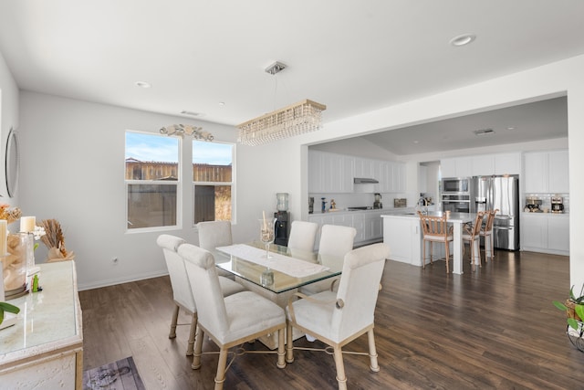 dining area featuring dark wood-style floors and recessed lighting