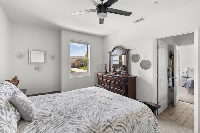 bedroom with wood finished floors and a ceiling fan