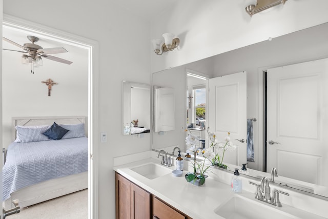 full bath featuring ensuite bathroom, double vanity, and a ceiling fan