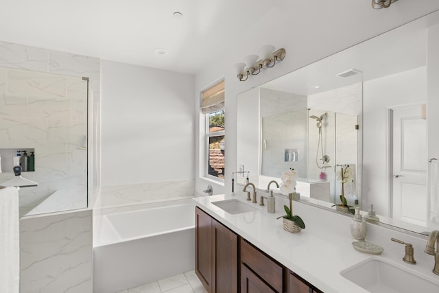 full bathroom with a marble finish shower, a garden tub, and double vanity