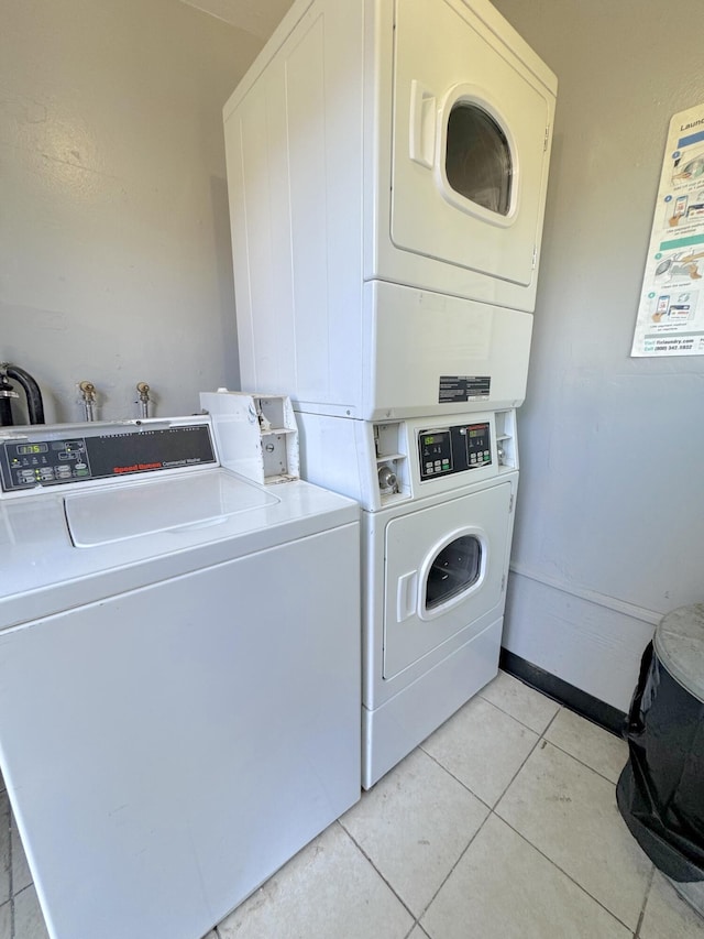5401 Perkins Rd, Oxnard, CA 93033 - communal laundry room with stacked washer and clothes dryer, light tile patterned floors, and washing machine and clothes dryer