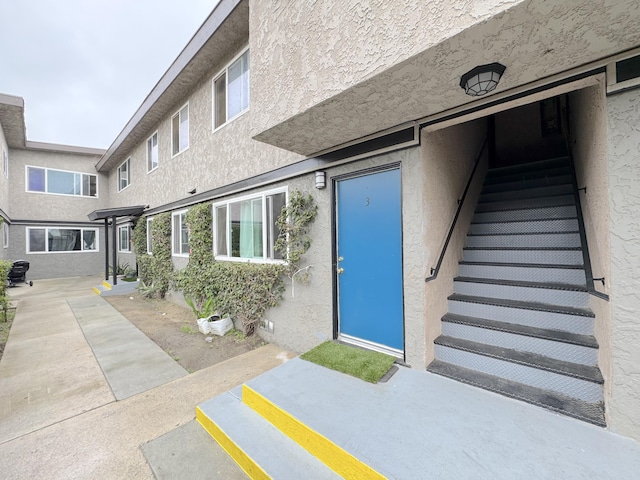 5401 Perkins Rd, Oxnard, CA 93033 - property entrance with stucco siding and a patio
