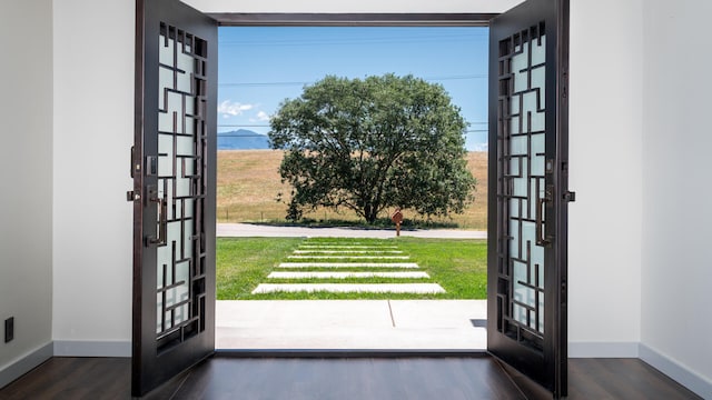 1311 Meadowvale Rd, Santa Ynez, CA 93460 - entryway featuring french doors, baseboards, and wood finished floors