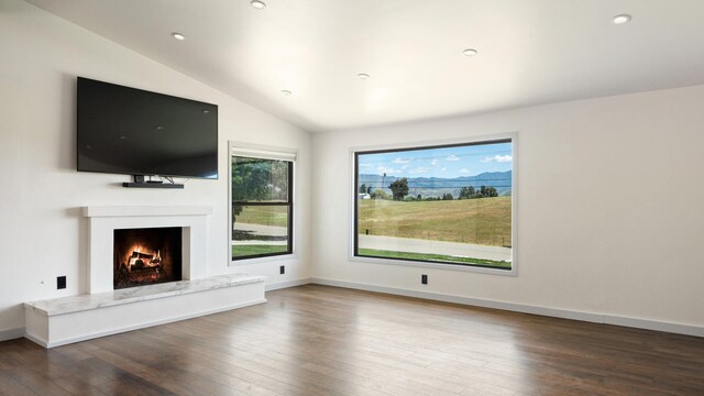 1311 Meadowvale Rd, Santa Ynez, CA 93460 - unfurnished living room with wood-type flooring, vaulted ceiling, a high end fireplace, recessed lighting, and baseboards