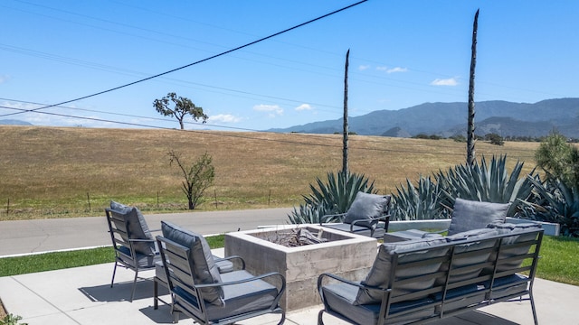 1311 Meadowvale Rd, Santa Ynez, CA 93460 - view of patio featuring a fire pit and a mountain view