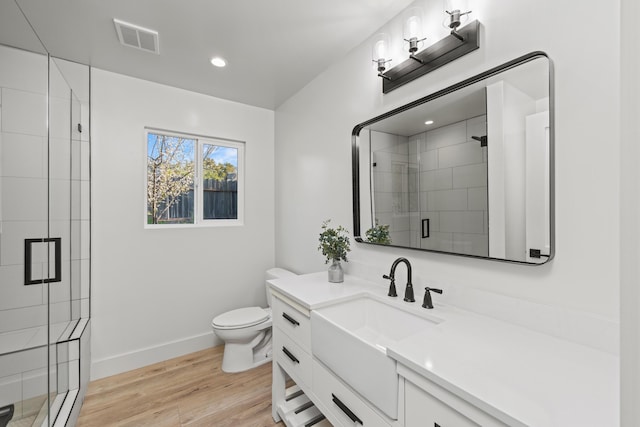 246 3rd St, Solvang, CA 93463 - bathroom with toilet, a stall shower, baseboards, wood finished floors, and recessed lighting
