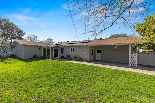 246 3rd St, Solvang, CA 93463 - back of property featuring solar panels, stucco siding, and a patio area