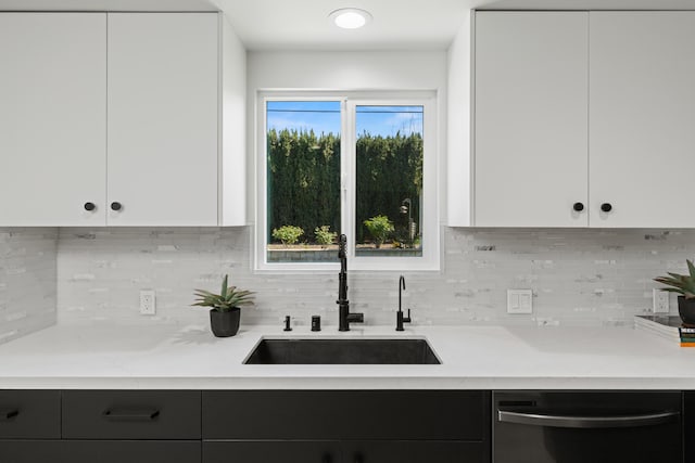 246 3rd St, Solvang, CA 93463 - kitchen featuring stainless steel dishwasher, a sink, modern cabinets, decorative backsplash, and white cabinetry
