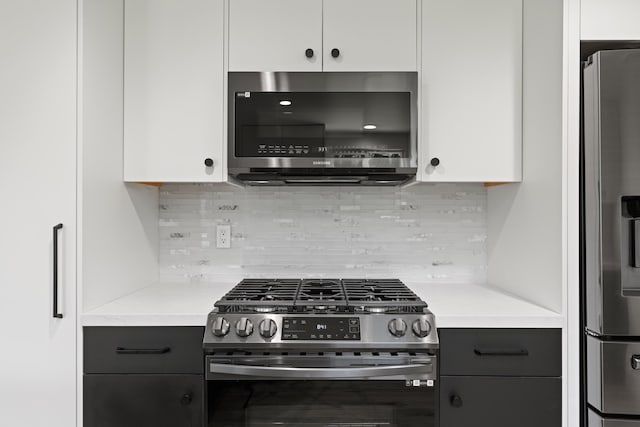 246 3rd St, Solvang, CA 93463 - kitchen with stainless steel appliances, light countertops, tasteful backsplash, and white cabinets