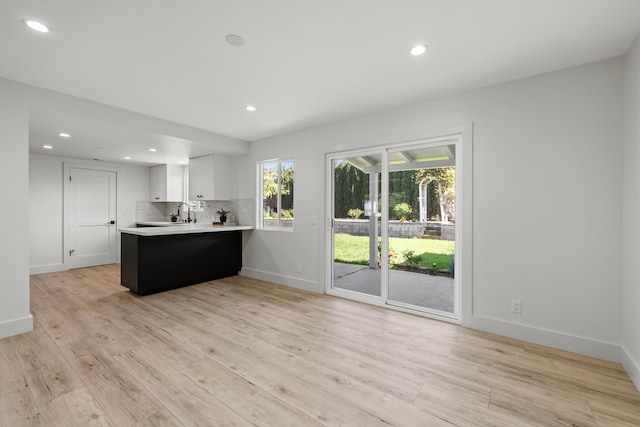 246 3rd St, Solvang, CA 93463 - kitchen featuring light countertops, a peninsula, light wood-style floors, recessed lighting, and baseboards
