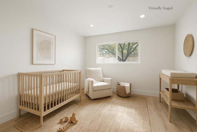 246 3rd St, Solvang, CA 93463 - bedroom featuring wood finished floors, baseboards, a crib, and recessed lighting