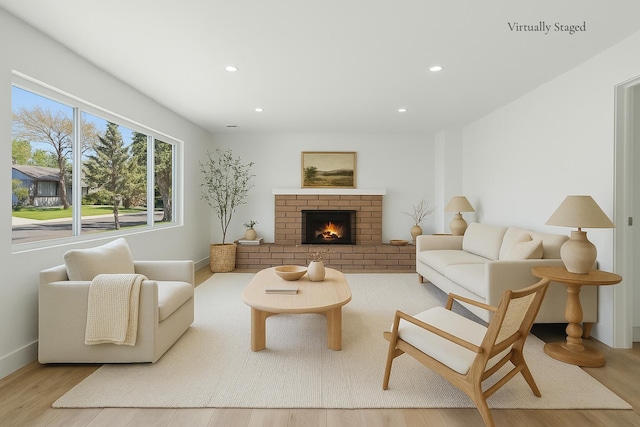 246 3rd St, Solvang, CA 93463 - living room with wood finished floors, recessed lighting, a fireplace, and baseboards