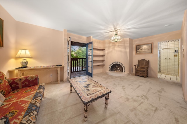 725 Ashley Rd, Montecito, CA 93108 - carpeted living room featuring a lit fireplace