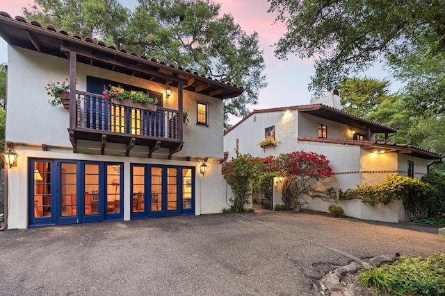 725 Ashley Rd, Montecito, CA 93108 - view of front of property featuring a balcony, stucco siding, and a garage