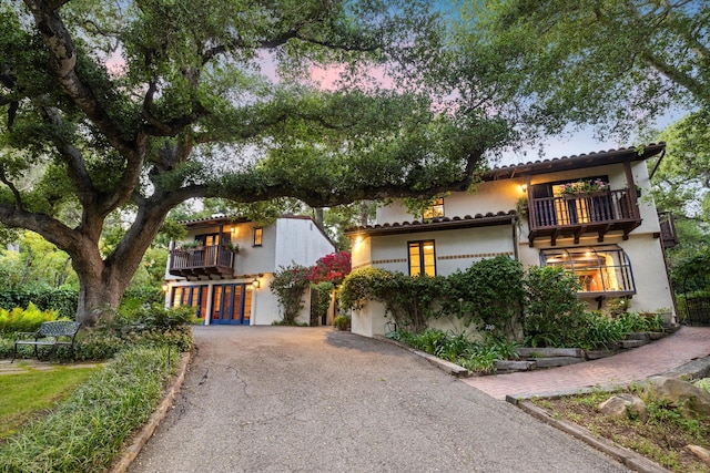 725 Ashley Rd, Montecito, CA 93108 - mediterranean / spanish-style house featuring a balcony, asphalt driveway, and stucco siding