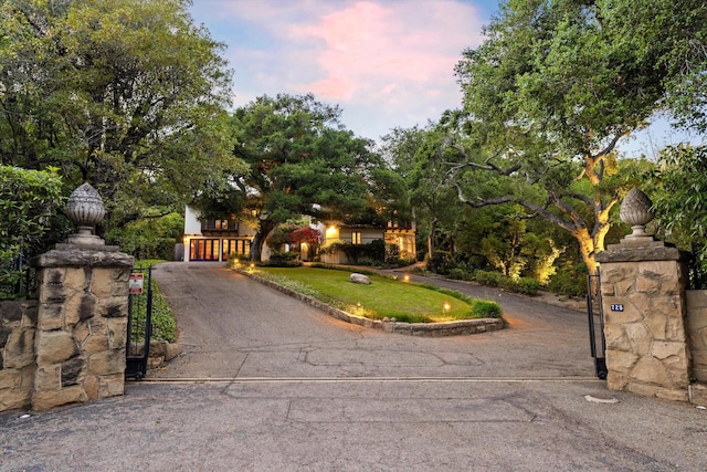 725 Ashley Rd, Montecito, CA 93108 - obstructed view of property featuring a gate and curved driveway