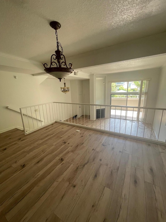 4305 Redwood Ave Unit 10, Los Angeles, CA 90292 - unfurnished room with wood-type flooring and a textured ceiling