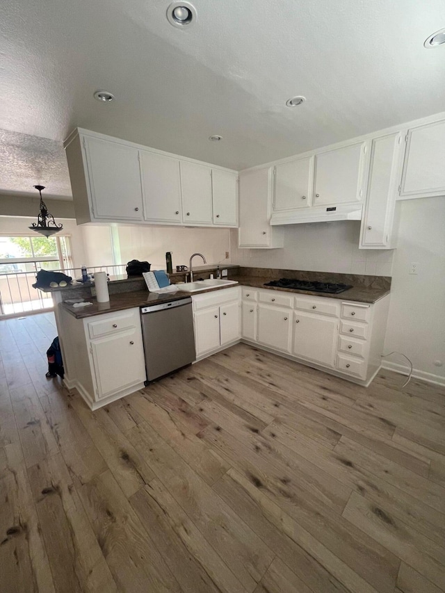4305 Redwood Ave Unit 10, Los Angeles, CA 90292 - kitchen with dishwasher, light wood finished floors, a sink, dark countertops, and white cabinetry
