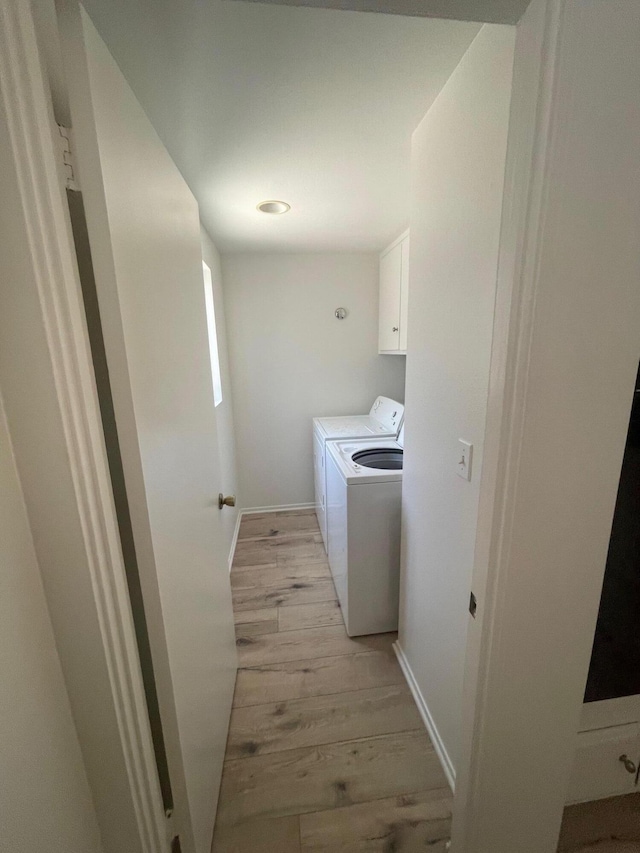 4305 Redwood Ave Unit 10, Los Angeles, CA 90292 - clothes washing area with washing machine and dryer, cabinet space, light wood-style flooring, and baseboards