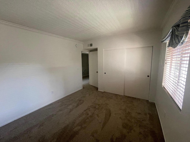 4305 Redwood Ave Unit 10, Los Angeles, CA 90292 - unfurnished bedroom featuring a textured ceiling, carpet floors, a closet, and crown molding