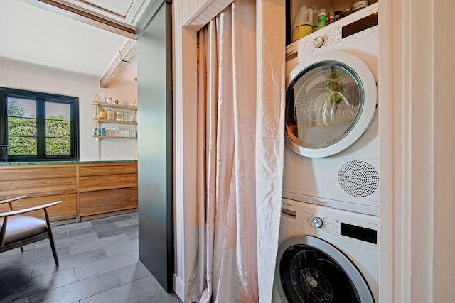 3018 Ventura Dr, Santa Barbara, CA 93105 - laundry area with stacked washer and clothes dryer and crown molding