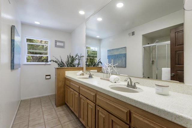 1649 Miramesa Dr, Santa Barbara, CA 93109 - full bath featuring double vanity, a stall shower, tile patterned floors, baseboards, and recessed lighting