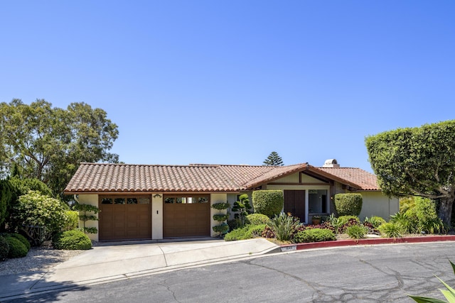 1649 Miramesa Dr, Santa Barbara, CA 93109 - view of front of property featuring a garage, stucco siding, and a tile roof