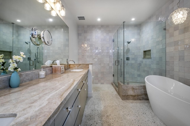 4477 Shadow Hills Blvd Unit A, Santa Barbara, CA 93105 - full bathroom with vanity, tile walls, speckle patterned floor, a shower stall, and a soaking tub