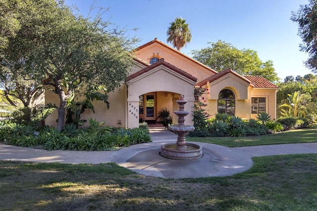 4477 Shadow Hills Blvd Unit A, Santa Barbara, CA 93105 - mediterranean / spanish house featuring stucco siding, a front yard, and a tile roof