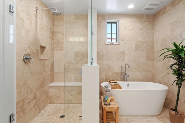 3736 State St Unit 109, Santa Barbara, CA 93105 - full bath with a tile shower, a soaking tub, and tile walls