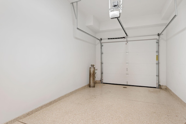 3736 State St Unit 109, Santa Barbara, CA 93105 - garage featuring a garage door opener and baseboards