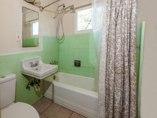4810 Cebrian Ave, New Cuyama, CA 93254 - full bath with plenty of natural light, shower / bath combination with curtain, tile walls, wainscoting, and tile patterned flooring