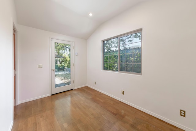 5150 Concord Pl, Carpinteria, CA 93013 - spare room with wood finished floors, lofted ceiling, baseboards, and recessed lighting
