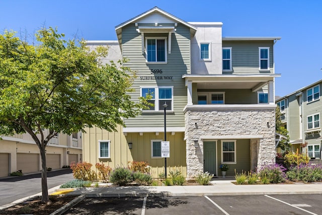 5696 Surfrider Way Unit 101, Goleta, CA 93117 - view of building exterior with uncovered parking
