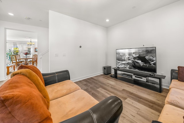 5696 Surfrider Way Unit 101, Goleta, CA 93117 - living room with a chandelier, wood finished floors, recessed lighting, and baseboards