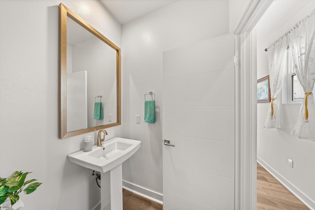 5696 Surfrider Way Unit 101, Goleta, CA 93117 - bathroom with wood finished floors and baseboards