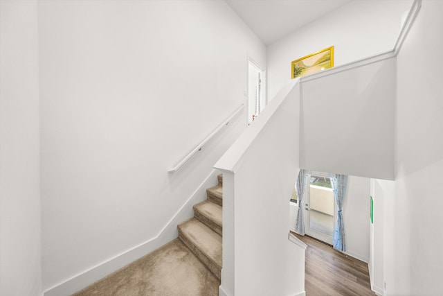 5696 Surfrider Way Unit 101, Goleta, CA 93117 - stairway featuring baseboards and wood finished floors