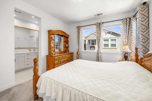 5696 Surfrider Way Unit 101, Goleta, CA 93117 - bedroom featuring light colored carpet, connected bathroom, and recessed lighting